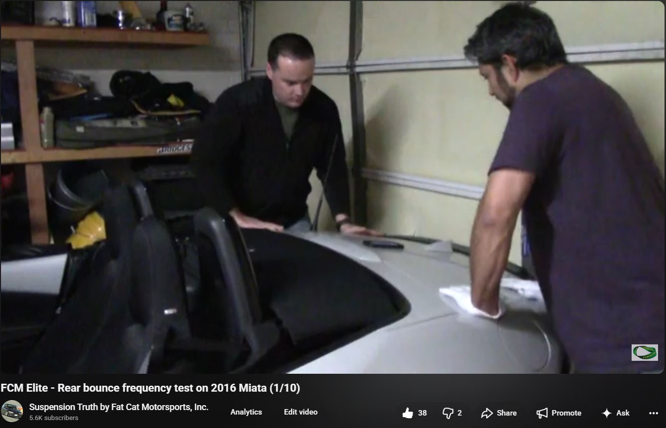 Travis and Jalal measuring rear bounce frequency on a 2016 Mazda Miata